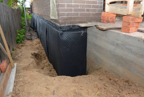Happy homeowners after waterproofing job in Continental